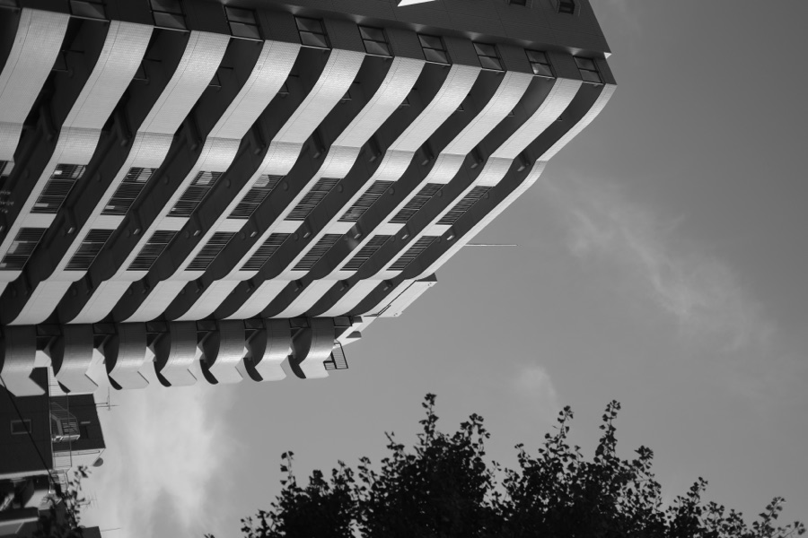 A striped apartment block against the sky